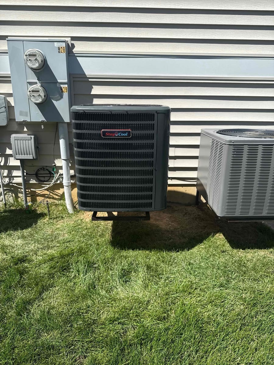 air conditioner installation on exterior home wall