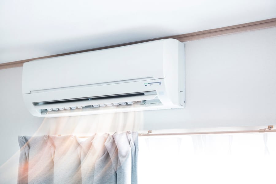 mini-split on wall above window