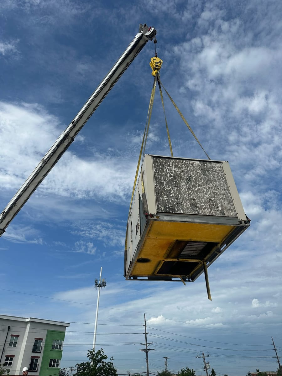 HVAC being lifted for commercial HVAC services