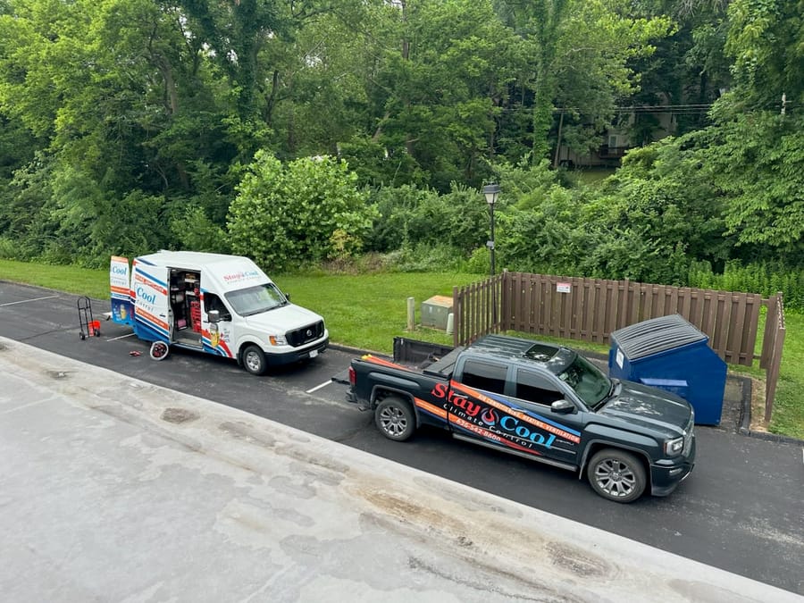 Trucks in driveway readying for HVAC zoning system service