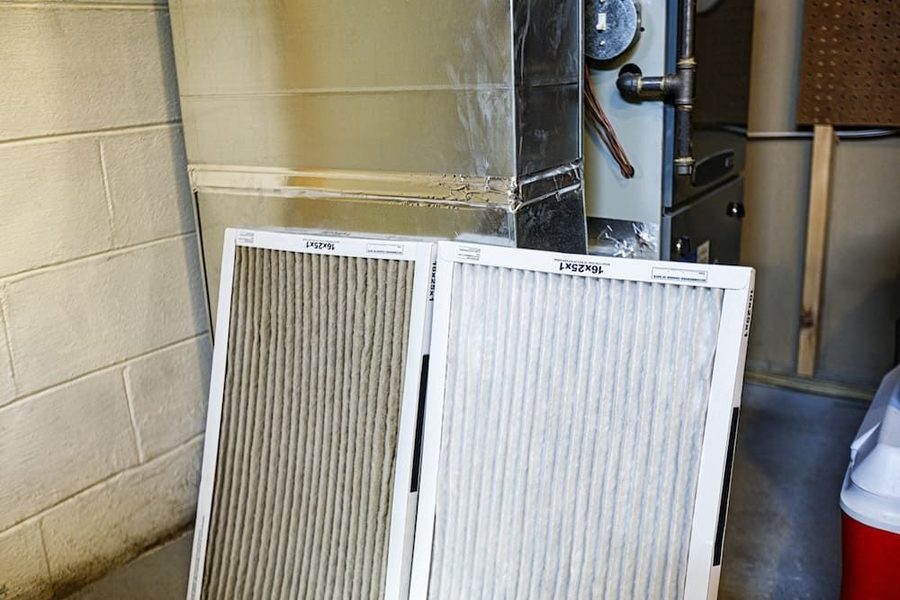 Furnace filter being changed before heating season
